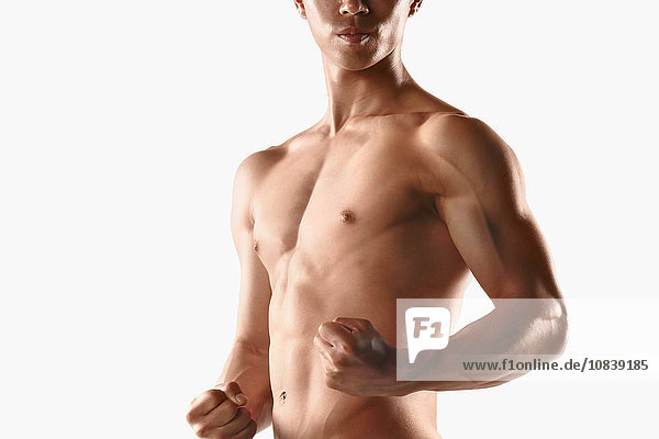 Japanese male athlete showing off muscles