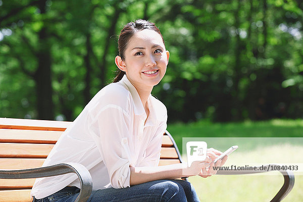 Japanese attractive woman in a city park