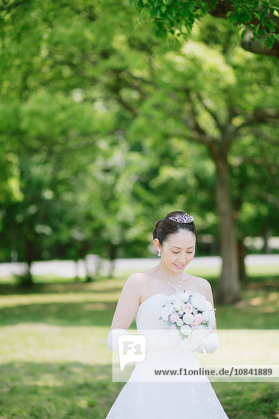 Japanese attractive bride in a city park