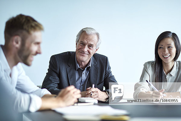 Portrait smiling senior businessman in meeting