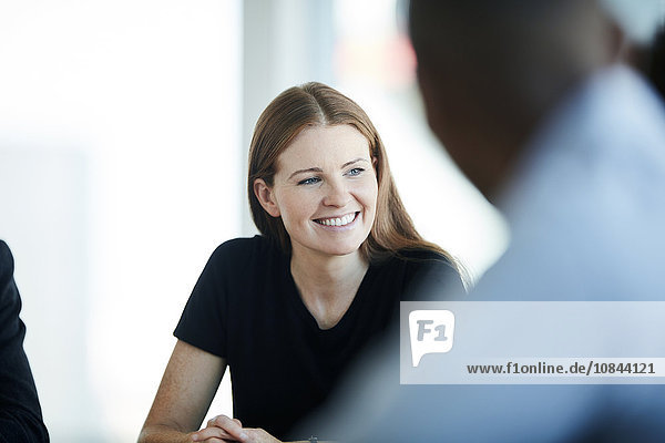 Smiling businesswoman in meeting