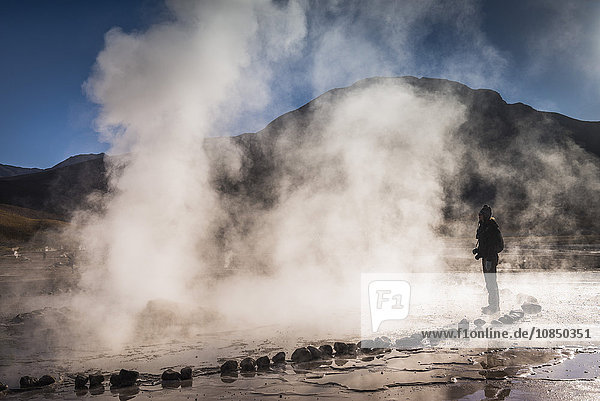 Tourist at El Tatio Geysers (Geysers del Tatio)  the largest geyser field in the Southern Hemisphere  Atacama Desert  Chile  South America