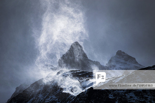 Wind sweeping snow off mountains  Torres del Paine National Park  Patagonia  Chile  South America