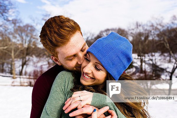 Romantic young couple in snowy Central Park  New York  USA