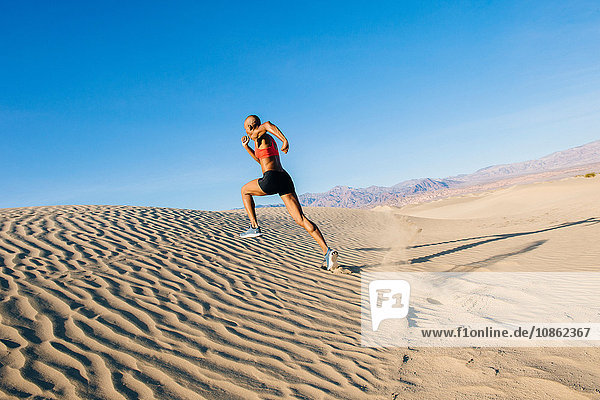 Runner sprinting in desert  Death Valley  California  USA