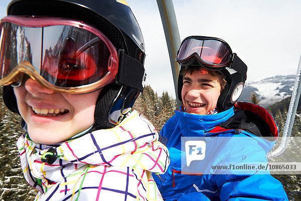 Teenage boy and girl on ski lift