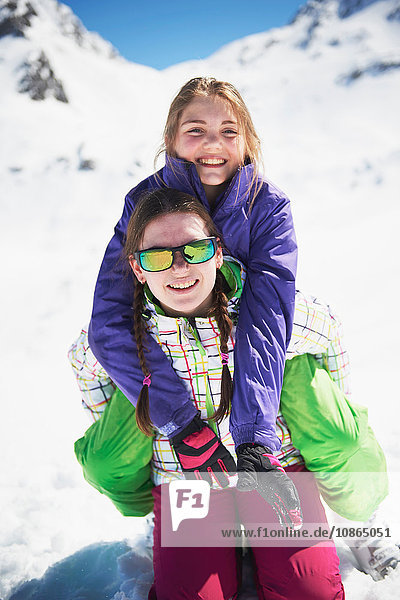 Portrait of two sisters in ski-wear