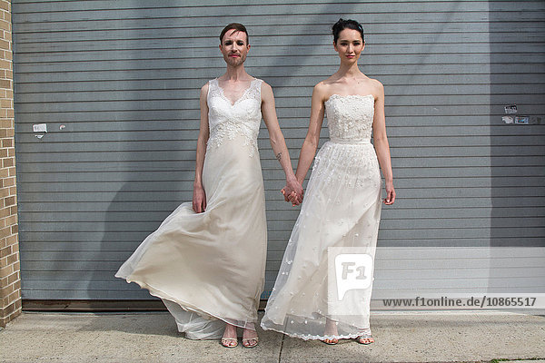 Gender fluid model and female model in couture bridal attire
