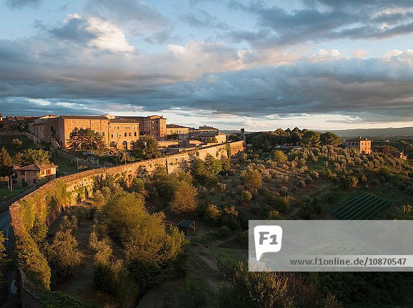 Apartment buildings and landscape on the outskirts of the medieval city of Siena Tuscany Italy