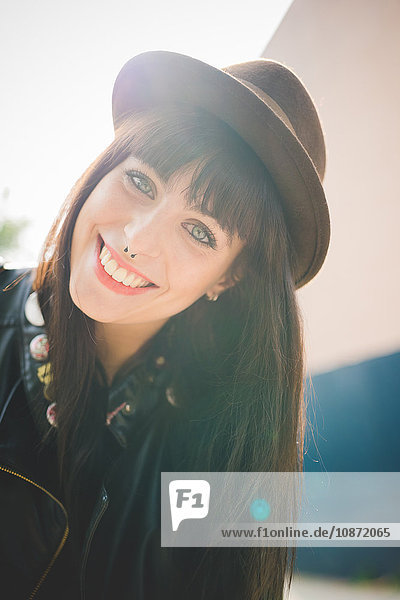 Happy young woman with nose rings