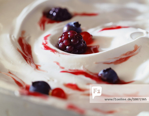 Blackberries and blueberries in yoghurt  close-up