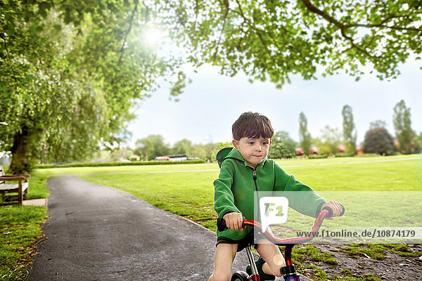 Boy cycling in park  Richmond  London