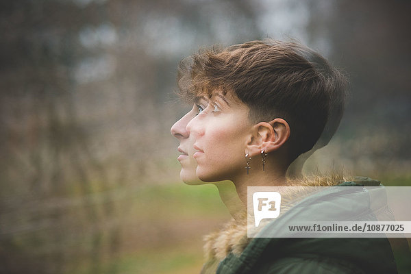 Young woman  side view  multiple exposure