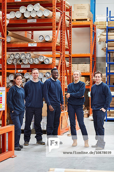 Portrait of factory work team in factory warehouse