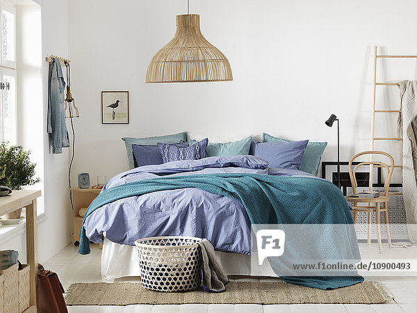 Sweden,  Vastergotland,  Bedroom with large bed
