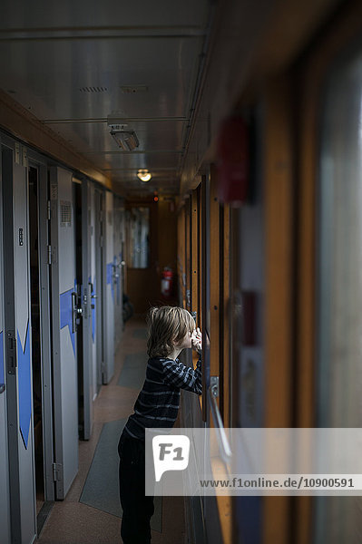 Sweden Jamtland Are Boy (8-9) looking through train window
