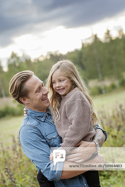 Finland  Uusimaa  Raasepori  Karjaa  Father holding his daughter (6-7)