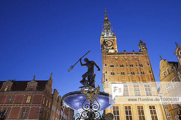 Poland  Gdansk  Neptune Fountain and city hall in the old town by night