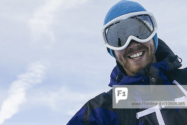 Man with ski goggles smiling