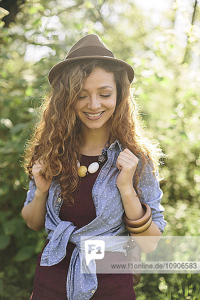 Portrait of smiling young woman hiking
