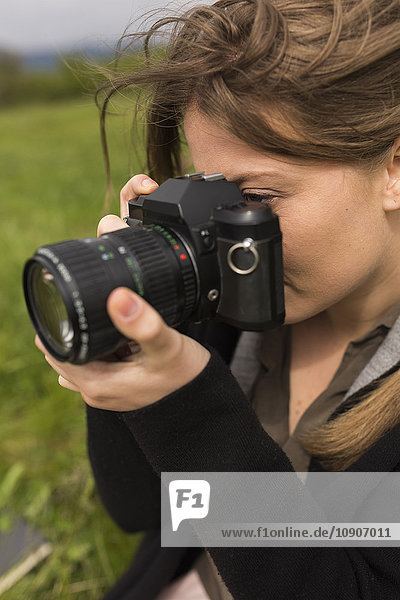 Woman photographing in nature