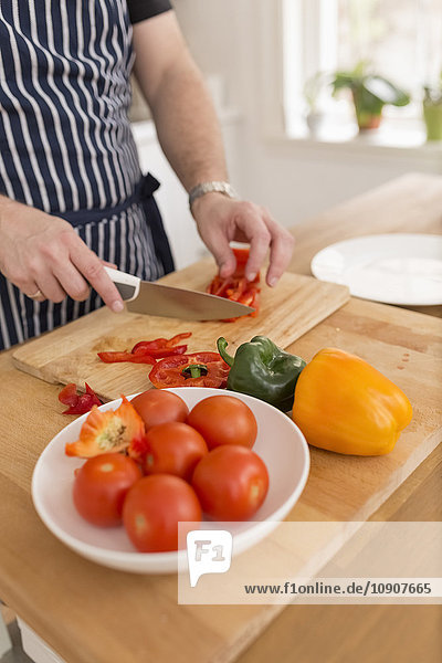 Man preparing vegetables in the kitchen
