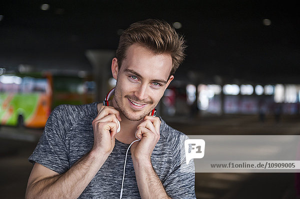 Portrait of smiling young man with headphones