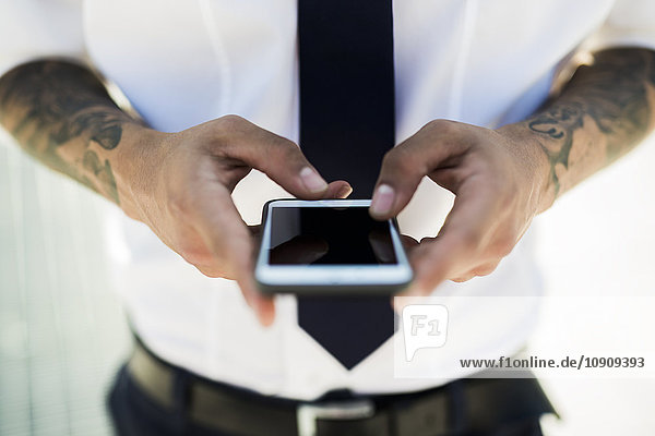 Man's hands text messaging  close-up