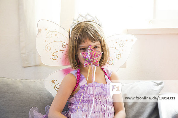 Portrait of little girl dressed up as fairy queen