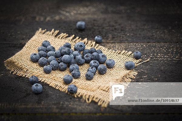 Blueberries on jute and wood