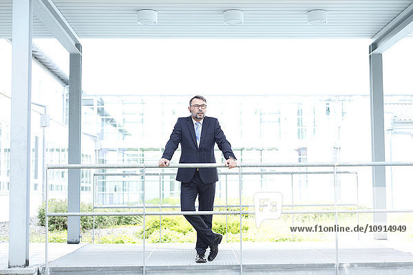 Businessman outside office building
