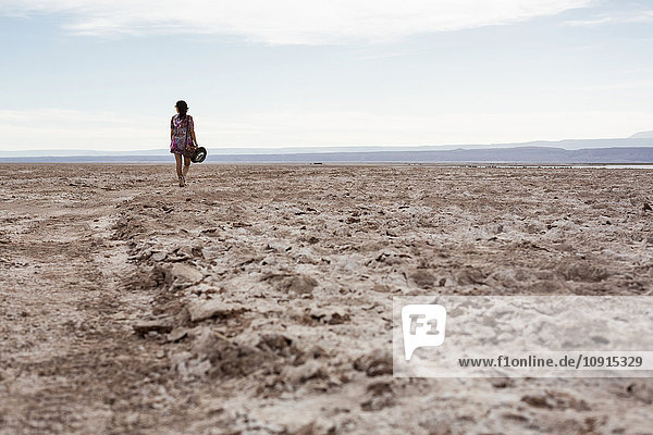 Chile  San Pedro de Atacama  woman walking in the desert