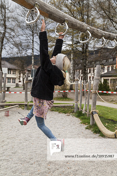 Girl using equipment on playground