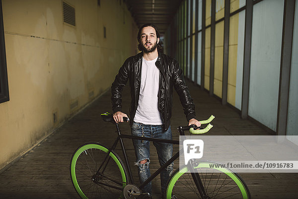 Young man with fixie bike