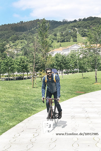 Spain  Bilbao  man riding racing cycle