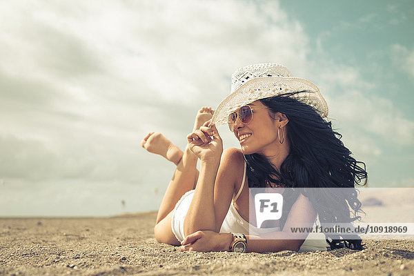 Young woman relaxing on the beach