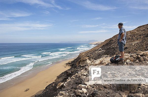 Spain  Canary Islands  Fuerteventura  North coast  beach of Barlovento  hiker