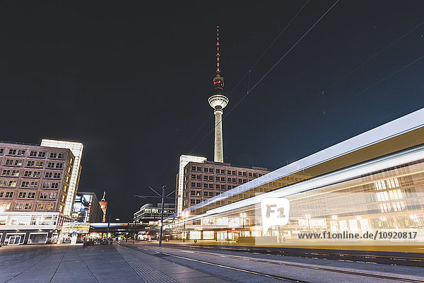 Germany  Berlin  Alexanderplatz and TV Tower at night  light trail of tramway