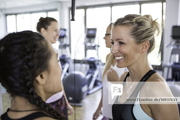 Women in exercise class taking a break