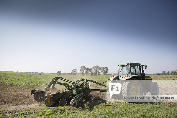 Tractor drilling field