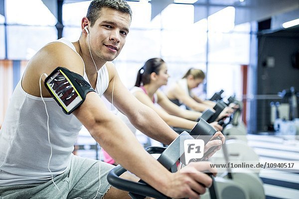 Man listening to music in gym