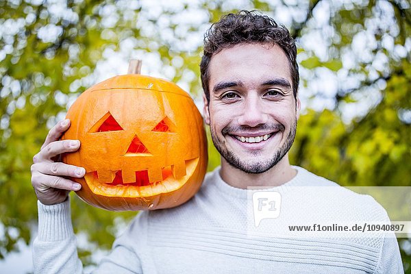 Man with Halloween pumpkin