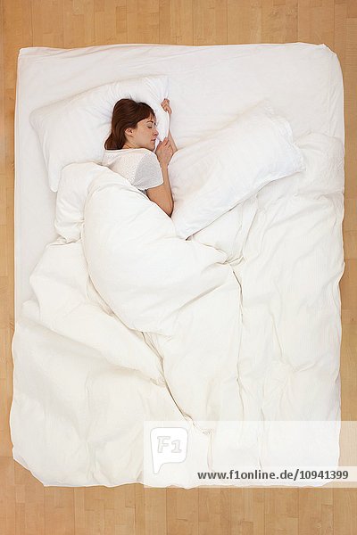 Woman lying in bed  asleep