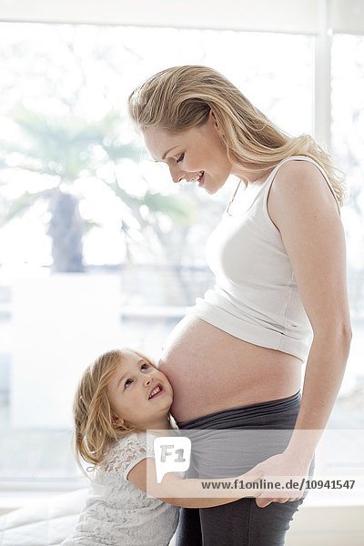 Girl with pregnant mother