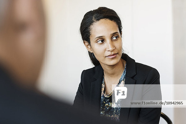 Businesswoman concentrating in meeting at office