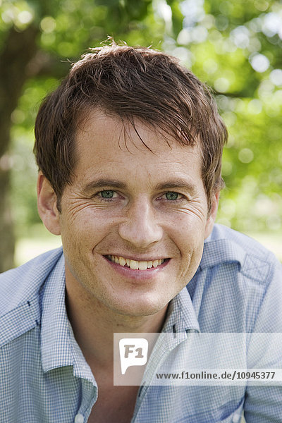 Portrait of man smiling outdoors