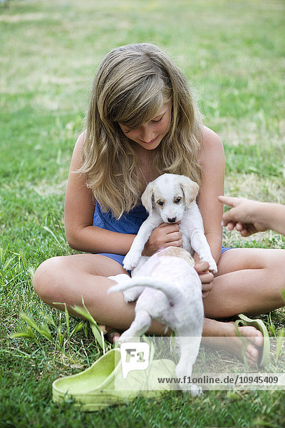 Italy  girl playing with puppies
