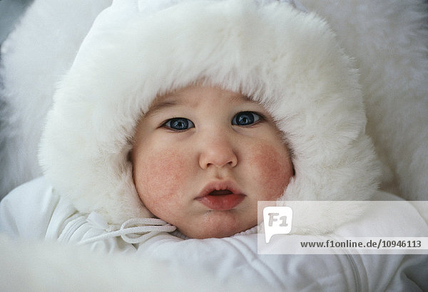 Baby boy wearing fur hat