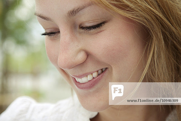 Close up of face of smiling woman