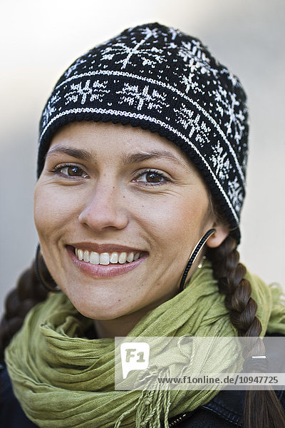 Portrait of young woman wearing knit hat